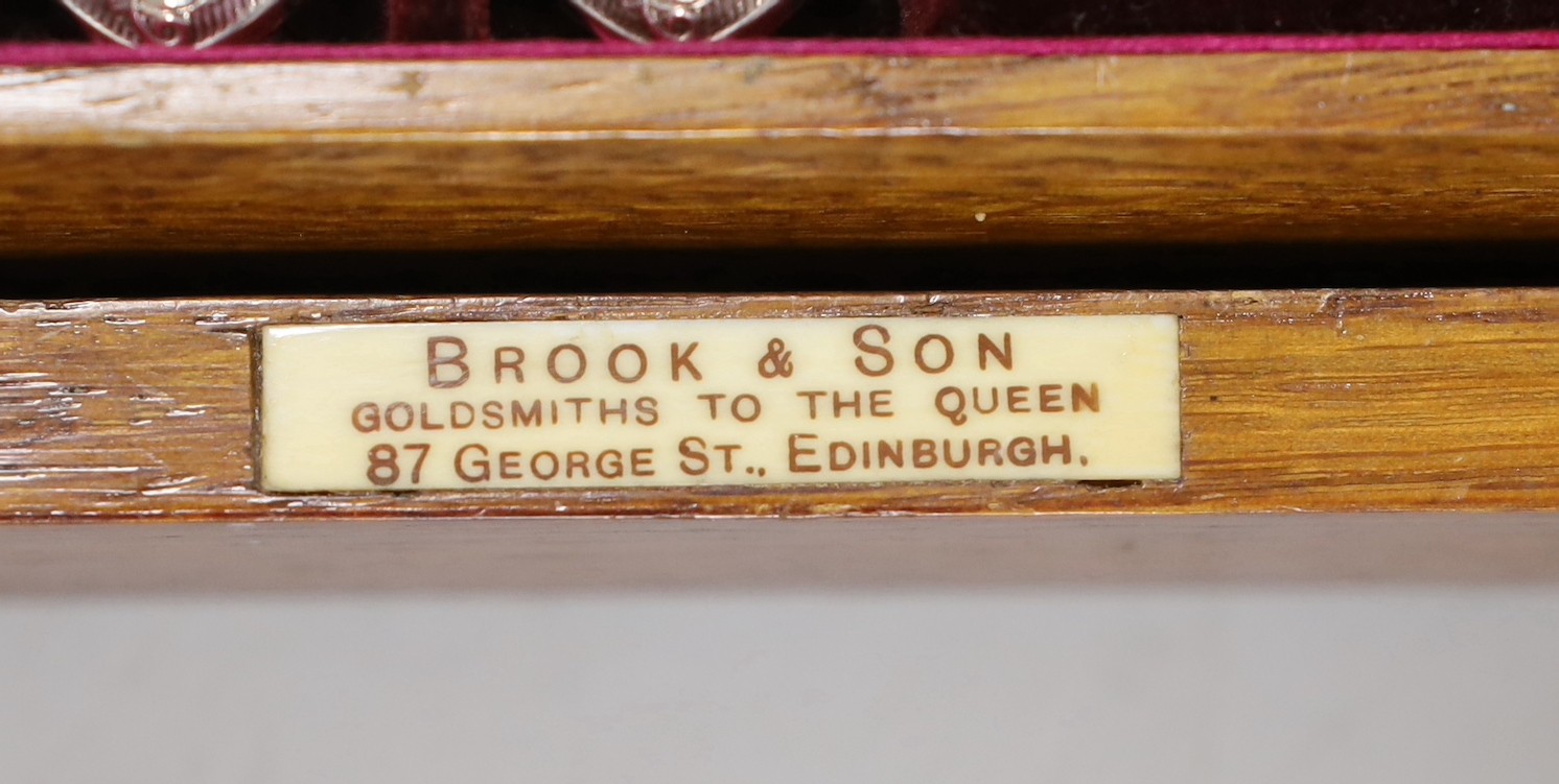An oak cased Brook & Son ornate plated fruit set of knives and forks